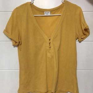 Yellow t-shirt.